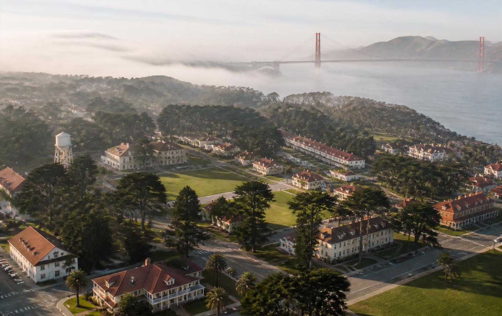 Aerial view of the Presidio with the Golden Gate Bridge in fog